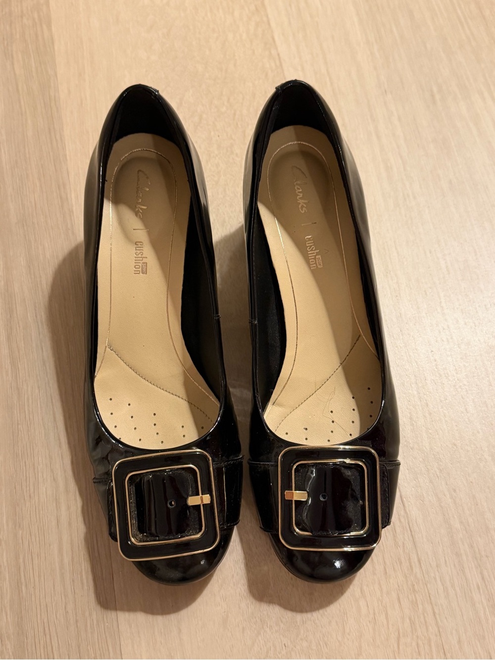 Clarks Black Patent Rounded Toe Flats with Gold Buckle Accent